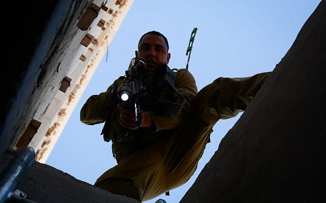 A soldier searches in the West Bank for three abducted Israeli teens, June 23, 2014. (Photo credit: IDF SPokesperson/Flash90) A soldier searches in the West Bank for three abducted Israeli teens, June 23, 2014. (Photo credit: IDF SPokesperson/Flash90)