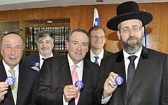 Former Arkansas governor Mike Huckabee, center, with Chief Rabbi David Lau in Jerusalem, June 23, 2014 (photo credit:  Itsik Nisim)