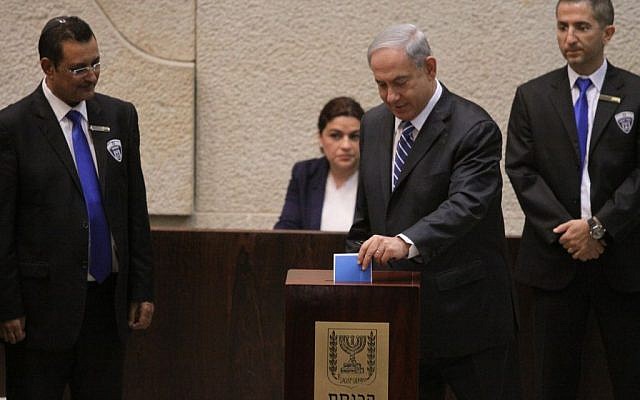 Prime Minister Benjamin Netanyahu casts his ballot for Israel's next president, in the Knesset, Tuesday, June 10, 2014 (photo credit: Knesset spokesman)