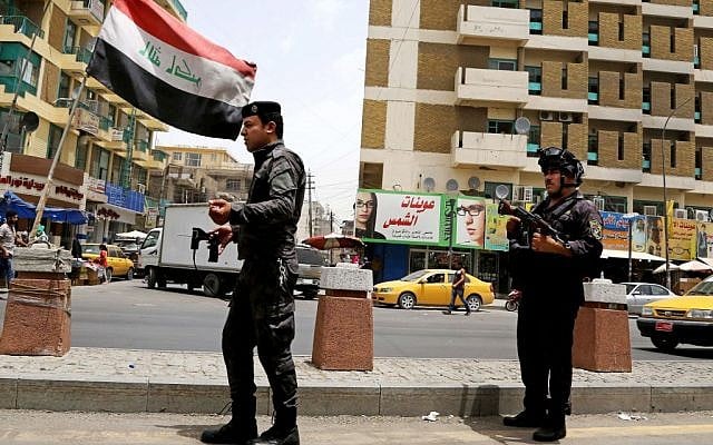 File: Iraqi federal policemen stand guard at a checkpoint in Baghdad, Iraq, Wednesday, June. 11, 2014. (AP/Karim Kadim) File: Iraqi federal policemen stand guard at a checkpoint in Baghdad, Iraq, Wednesday, June. 11, 2014. (AP/Karim Kadim)