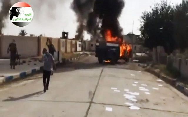 This image made from video posted by Iraqi0Revolution, a group supporting the al-Qaeda breakaway Islamic State of Iraq and the Levant (ISIL) on Wednesday, June 11, 2014, shows an attack on a base north of Tikrit, Iraq. (photo credit: AP Photo/Iraqi0Revolution via AP video) This image made from video posted by Iraqi0Revolution, a group supporting the al-Qaeda breakaway Islamic State of Iraq and the Levant (ISIL) on Wednesday, June 11, 2014, shows an attack on a base north of Tikrit, Iraq. (photo credit: AP Photo/Iraqi0Revolution via AP video)
