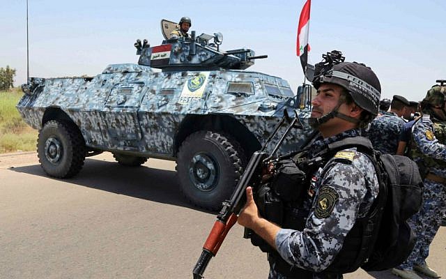 Iraqi federal policemen patrol in Baghdad's Abu Ghraib suburb, Iraq, Saturday, June 28, 2014. Iraqi troops launched an operation this week to push back Islamic State advances in Anbar province. (AP Photo/Karim Kadim) Iraqi federal policemen patrol in Baghdad's Abu Ghraib suburb, Iraq, Saturday, June 28, 2014. Iraqi troops launched an operation this week to push back Islamic State advances in Anbar province. (AP Photo/Karim Kadim)