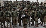 Israeli soldiers patrol in the village of Beit Kahil near the West Bank city of Hebron on June 21, 2014. (AP/Majdi Mohammed)