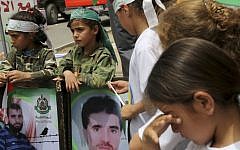 File: Palestinian girls from summer camps attend a protest calling for the release of Palestinian prisoners from Israeli jails, in front of the International Red Cross, Gaza City, the northern Gaza Strip, Wednesday, June 4, 2014. (AP/Adel Hana)