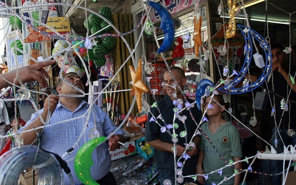 Illustrative: A Palestinian vendor displays decorations at a market ahead of Ramadan in the West Bank city of Jenin, June 28, 2014. (AP/Mohammed Ballas) Illustrative: A Palestinian vendor displays decorations at a market ahead of Ramadan in the West Bank city of Jenin, June 28, 2014. (AP/Mohammed Ballas)