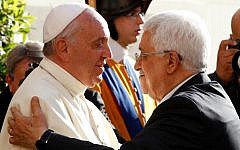 Pope Francis welcomes Palestinian Authority President Mahmoud Abbas, right, as he arrives at the Vatican, Sunday, June 8, 2014. (AP Photo/Riccardo De Luca, Pool)