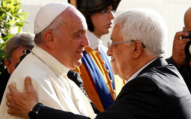 Pope Francis welcomes Palestinian Authority President Mahmoud Abbas, right, as he arrives at the Vatican, Sunday, June 8, 2014. (AP Photo/Riccardo De Luca, Pool)