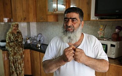 Omar Abu Aysha, father of suspected kidnapper Amer Abu Aysha, in his home in Hebron (photo credit: Courtesy)