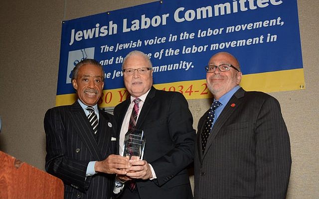 The Rev. Al Sharpton presented the Jewish Labor Committee’s Human Rights Award to Lee Saunders (center), president of the American Federation of State, County and Municipal Employees, standing beside the JLC’s president, Stuart Appelbaum (right), at the group’s awards dinner in New York, June 19, 2014. (photo credit: Courtesy/Jewish Labor Committee) The Rev. Al Sharpton presented the Jewish Labor Committee’s Human Rights Award to Lee Saunders (center), president of the American Federation of State, County and Municipal Employees, standing beside the JLC’s president, Stuart Appelbaum (right), at the group’s awards dinner in New York, June 19, 2014. (photo credit: Courtesy/Jewish Labor Committee)