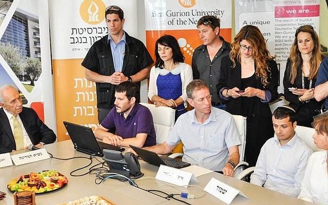Professor Yuval Elovici (center, seated) and members of the BGU Cyber-Lab brief President Shimon Peres about new cyber-threats (Photo credit: Courtesy BGU) Professor Yuval Elovici (center, seated) and members of the BGU Cyber-Lab brief President Shimon Peres about new cyber-threats (Photo credit: Courtesy BGU)