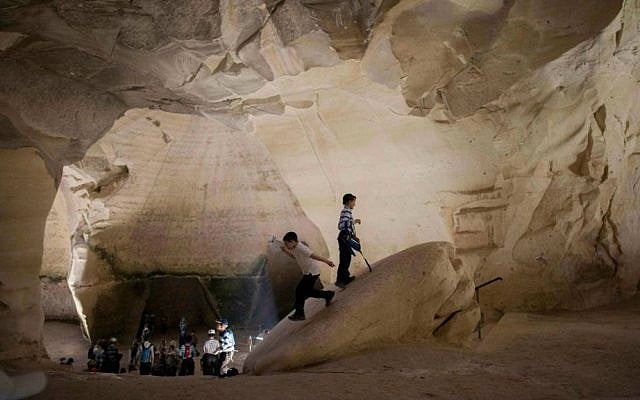 Tourists visiting ancient caves in Israel. (Yonatan Sindel/Flash90)