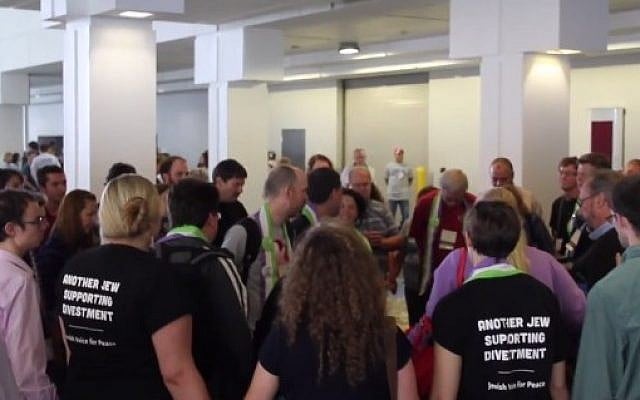 Several attendants of the Presbyterian General Assembly in Detroit form a prayer circle and sing for Israeli-Arab peace. Two are seen wearing shirts which read: 'Another Jew supporting divestment.' (screen capture: YouTube) Several attendants of the Presbyterian General Assembly in Detroit form a prayer circle and sing for Israeli-Arab peace. Two are seen wearing shirts which read: 'Another Jew supporting divestment.' (screen capture: YouTube)