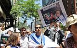 Demonstrators rally outside the Israeli consulate in Manhattan to express solidarity with three Israeli teens who were abducted in the West Bank, June 16, 2014. (photo credit: Miriam Moster/JTA)