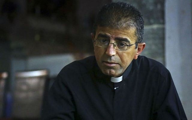 Friar Gabriel Tooma speaks to The Associated Press at the Chaldean Church of the Virgin Mary of the Harvest, in Alqosh,  June 15, 2014. (photo credit: AP)