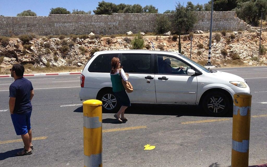 Illustrative: Men, women and teens all hitchhike at the side of Route 60, but they look for familiar faces and looks in their drivers (photo credit: Jessica Steinberg/Times of Israel) Illustrative: Men, women and teens all hitchhike at the side of Route 60, but they look for familiar faces and looks in their drivers (photo credit: Jessica Steinberg/Times of Israel)