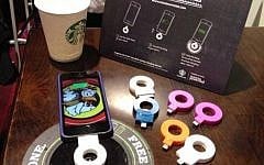 A cellphone recharging on a Powermat Spot at a California Starbucks (Photo credit: Courtesy)