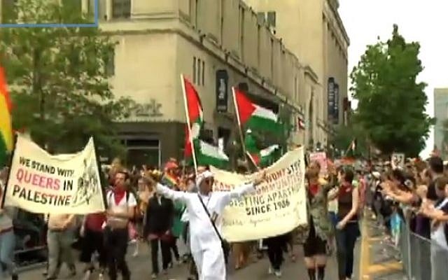 Representatives of Queers Against Israeli Apartheid march in the 2009 Toronto Pride Parade (photo credit: Youtube screenshot) Representatives of Queers Against Israeli Apartheid march in the 2009 Toronto Pride Parade (photo credit: Youtube screenshot)