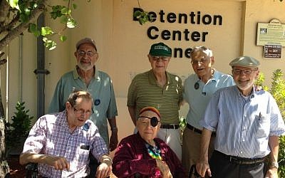 Six Reform rabbis pose outside the jail in St. Augustine, Florida, where they spent a night after being arrested protesting for civil rights 50 years earlier. Standing (from left to right), are Allen Secher, Israel Dresner, Jerrold Goldstein and Richard Levy. Sitting are Daniel Fogel, left, and Hanan Sills. (photo credit: Dina Weinstein/JTA)