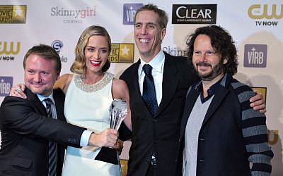 From left, Rian Johnson, Emily Blunt, James D. Stern and Ram Bergman pose backstage with the award for best sci-fi/horror movie for "Looper" backstage at the 18th Annual Critics' Choice Movie Awards at the Barker Hangar on Thursday, Jan. 10, 2013, in Santa Monica, Calif. (Photo by John Shearer/Invision/AP)