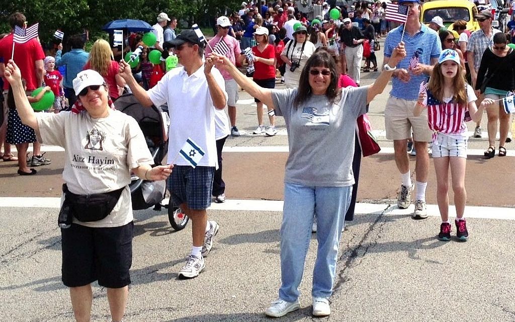 Members of the Aitz Hayim Center for Jewish Living in Glencoe, Ill., show U.S. and Israeli colors at the 2012 Fourth of July parade in nearby Highland Park. (Todd Jacobs/JTA) Members of the Aitz Hayim Center for Jewish Living in Glencoe, Ill., show U.S. and Israeli colors at the 2012 Fourth of July parade in nearby Highland Park. (Todd Jacobs/JTA)