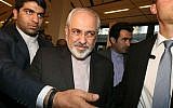 Iranian Foreign Minister Mohammad Javad Zarif, center, arrives for a press briefing for Iranian journalists after the closed-door nuclear talks at the International Center, in Vienna, Austria, Friday, June 20, 2014 (photo credit: AP/Ronald Zak)