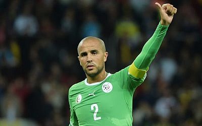 Algeria captain Madjid Bougherra gestures during a World Cup game, June 30, 2014 (photo credit: AFP/GABRIEL BOUYS)