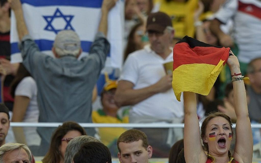 A fan of Germany cheers before the 2014 FIFA World Cup final football match between Germany and Argentina at the Maracana Stadium in Rio de Janeiro on July 13, 2014. (AFP PHOTO / JUAN MABROMATA)