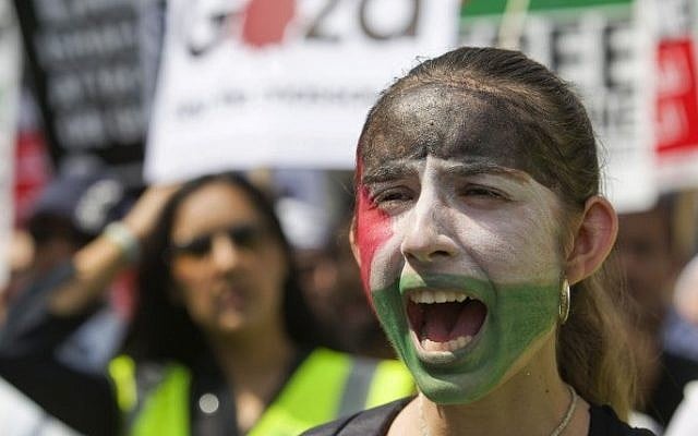 A demonstrator with a painted face marches through the streets from outside the Israeli embassy in central London on July 26, 2014 (Photo credit: Justin Tallis/AFP)