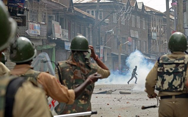 Kashmiri demonstrators clash with Indian police during a demonstration against Israeli military operations in Gaza, in downtown Srinagar on July 18, 2014. (photo credit: AFP/Tauseef Mustafa) Kashmiri demonstrators clash with Indian police during a demonstration against Israeli military operations in Gaza, in downtown Srinagar on July 18, 2014. (photo credit: AFP/Tauseef Mustafa)