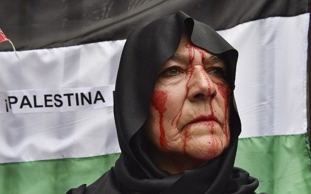 A pro-Palestinian activist participates in a rally against the Israeli military offensive in the Gaza Strip outside the Mexican Foreign Ministry building in Mexico City on July 11, 2014 (Photo credit: Yuri Cortez/AFP)
