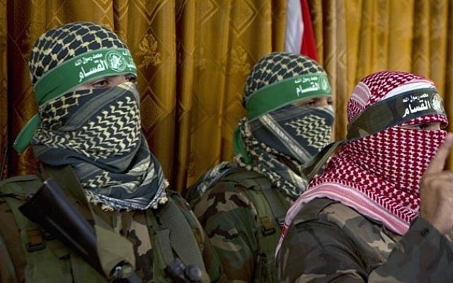 Abu Ubeida (right), the official spokesperson of the Palestinian militant group Izz ad-Din al-Qassam Brigade, the armed wing of Hamas, at a press conference on July 3, 2014, in Gaza City (photo credit: AFP/Mohammed Abed) Abu Ubeida (right), the official spokesperson of the Palestinian militant group Izz ad-Din al-Qassam Brigade, the armed wing of Hamas, at a press conference on July 3, 2014, in Gaza City (photo credit: AFP/Mohammed Abed)
