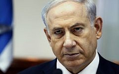 Prime Minister Benjamin Netanyahu looks on as he chairs the weekly cabinet meeting on Sunday, July 6, 2014 at his Jerusalem office. (photo credit: AFP/POOL/GALI TIBBON)
