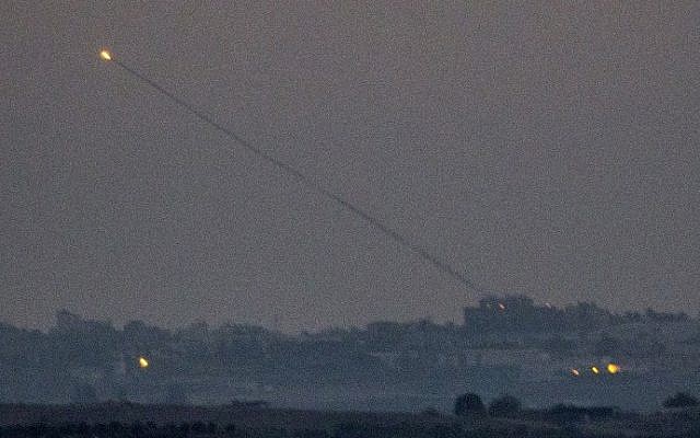 A picture taken from the southern Israeli Gaza border shows a rocket being launched from the Gaza strip into Israel on Thursday, July 10, 2014. (photo credit: Jack Guez/AFP) A picture taken from the southern Israeli Gaza border shows a rocket being launched from the Gaza strip into Israel on Thursday, July 10, 2014. (photo credit: Jack Guez/AFP)