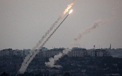A picture taken from the southern Israeli Gaza border shows a rocket being launched from the Gaza Strip into Israel on Friday, July 11, 2014. (photo credit: Menahem Kahana/AFP) A picture taken from the southern Israeli Gaza border shows a rocket being launched from the Gaza Strip into Israel on Friday, July 11, 2014. (photo credit: Menahem Kahana/AFP)