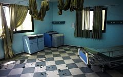 Broken glass in seen in a room of the Al-Wafa rehabilitation hospital near Gaza City on July 16, 2014 following a military strike. (photo credit: AFP/THOMAS COEX)