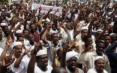 File: Sudanese men shout slogans during a protest against Israel's military operation in the Gaza Strip in the capital Khartoum on July 18, 2014. (photo credit: AFP/EBRAHIM HAMID) File: Sudanese men shout slogans during a protest against Israel's military operation in the Gaza Strip in the capital Khartoum on July 18, 2014. (photo credit: AFP/EBRAHIM HAMID)