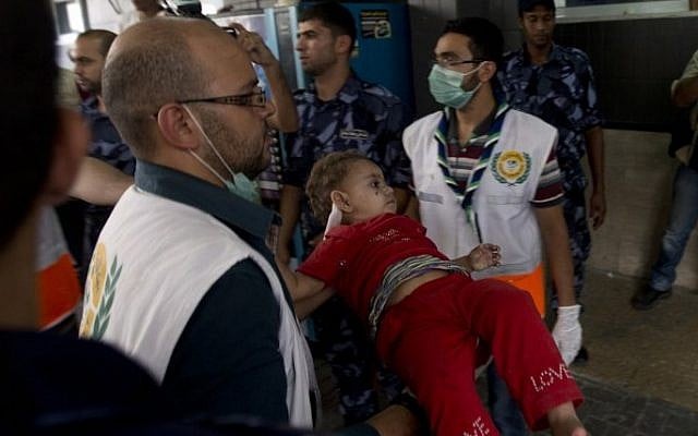 An injured Palestinian child arrives at Shifa hospital in Gaza City on July 20, 2014 (Photo credit: Mahmoud Hams/AFP)