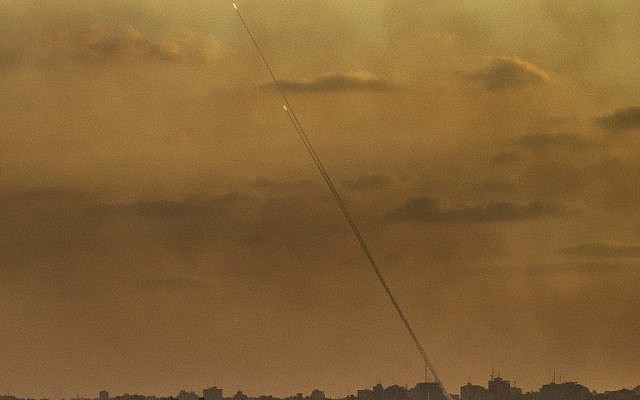 Illustrative. A picture taken from the southern Israeli Gaza border shows rockets being fired from the Gaza Strip into Israel, on July 24, 2014 (JACK GUEZ/AFP) Illustrative. A picture taken from the southern Israeli Gaza border shows rockets being fired from the Gaza Strip into Israel, on July 24, 2014 (JACK GUEZ/AFP)