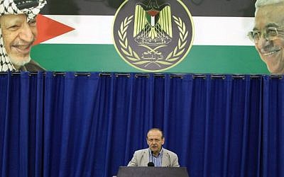 Yasser Abed Rabbo, Secretary General of the Palestine Liberation Organisation (PLO), announces that the Palestinian leadership along with Hamas and Islamic Jihad are willing to observe a 24-hour ceasefire in the war-torn Gaza Strip, during a press conference in the West Bank city of Ramallah on July 29, 2014. (photo credit: Abbas Momani/AFP)
