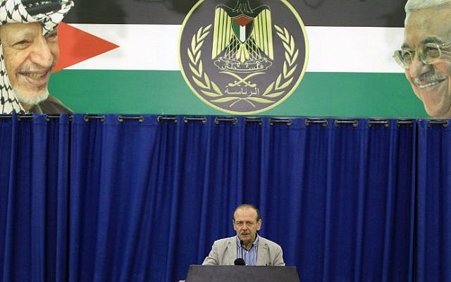 Yasser Abed Rabbo, Secretary General of the Palestine Liberation Organisation (PLO), announces that the Palestinian leadership along with Hamas and Islamic Jihad are willing to observe a 24-hour ceasefire in the war-torn Gaza Strip, during a press conference in the West Bank city of Ramallah on July 29, 2014. (photo credit: Abbas Momani/AFP)