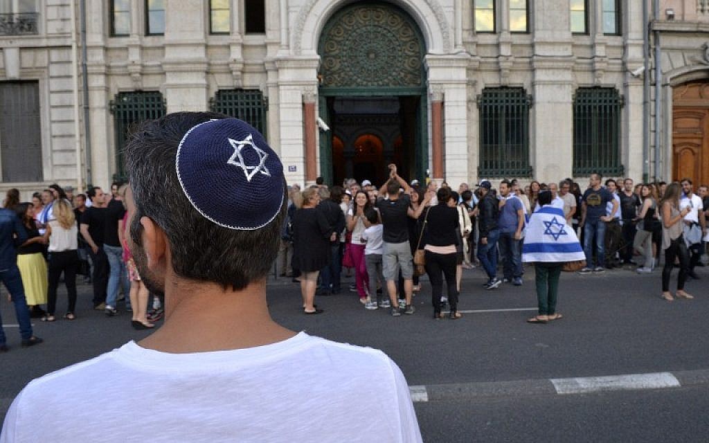 A man wearing a kipah looks on, as people take part in a demonstration called by the Representative Council of Jewish Institutions in France on July 31, 2014, in front of a Lyon synagogue. (AFP/Romain LaFabregue/File)