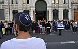 A man wearing a kipah looks on, as people take part in a demonstration called by the Representative Council of Jewish Institutions in France on July 31, 2014, in front of a Lyon synagogue. (AFP/Romain LaFabregue/File)