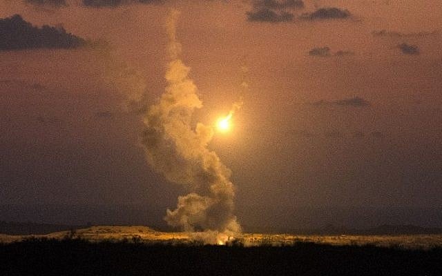 A picture taken on July 14, 2014 from the southern Israeli Gaza border shows Israeli army flares falling into the Palestinian enclave. (photo credit: Jack Guez/AFP)