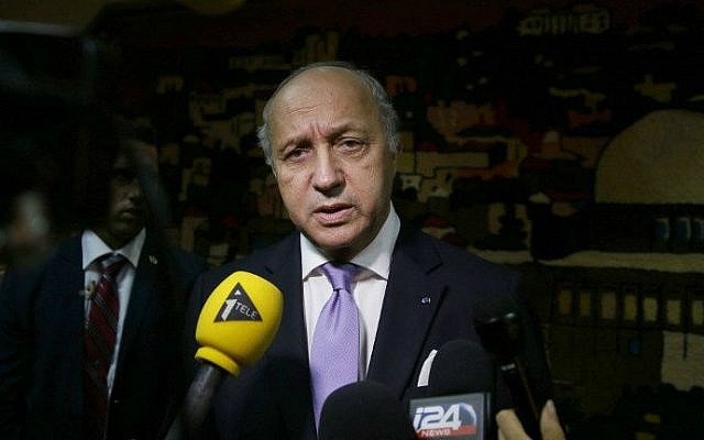 French Foreign Minister Laurent Fabius speaks to the press following his meeting with Israeli Prime Minister Benjamin Netanyahu, prior to his departure from Ben Gurion International Airport, near Tel Aviv, on July 19, 2014.  (photo credit: AFP/GALI TIBBON)