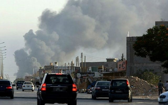 Smoke billowing from an area near Tripoli's international airport during fighting between rival factions around the capital's airport, July 24, 2014. (AFP /MAHMUD TURKIA) Smoke billowing from an area near Tripoli's international airport during fighting between rival factions around the capital's airport, July 24, 2014. (AFP /MAHMUD TURKIA)