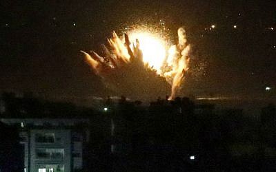 An IDF missile hits Palestinian buildings in Gaza City on July 17, 2014. Israel launched a ground operation in Gaza late Thursday on the 10th day of an offensive to stamp out rocket attacks from the Palestinian enclave, the army said. (photo credit: AFP/THOMAS COEX) An IDF missile hits Palestinian buildings in Gaza City on July 17, 2014. Israel launched a ground operation in Gaza late Thursday on the 10th day of an offensive to stamp out rocket attacks from the Palestinian enclave, the army said. (photo credit: AFP/THOMAS COEX)