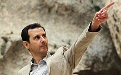 Syrian President Bashar al-Assad visiting troops, April 20, 2014. (AFP/HO/SANA)