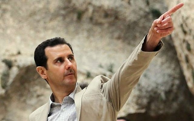 Syrian President Bashar al-Assad visiting troops, April 20, 2014. (AFP/HO/SANA) Syrian President Bashar al-Assad visiting troops, April 20, 2014. (AFP/HO/SANA)
