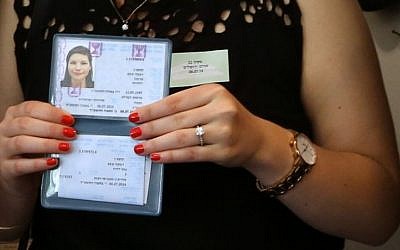New olah Becky Kupchan showing her Teudat Zehut (Israeli citizenship card) after her arrival in Israel on Tuesday, July 8, 2014. 