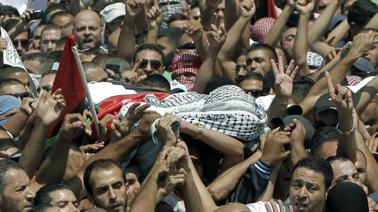 Relatives and friends of Mohammed Abu Khdeir, 16, carry his body to the mosque during his funerals in Shuafat, in israeli annexed East Jerusalem on July 4, 2014 (photo credit: AFP/ Thomas Coex) Relatives and friends of Mohammed Abu Khdeir, 16, carry his body to the mosque during his funerals in Shuafat, in israeli annexed East Jerusalem on July 4, 2014 (photo credit: AFP/ Thomas Coex)